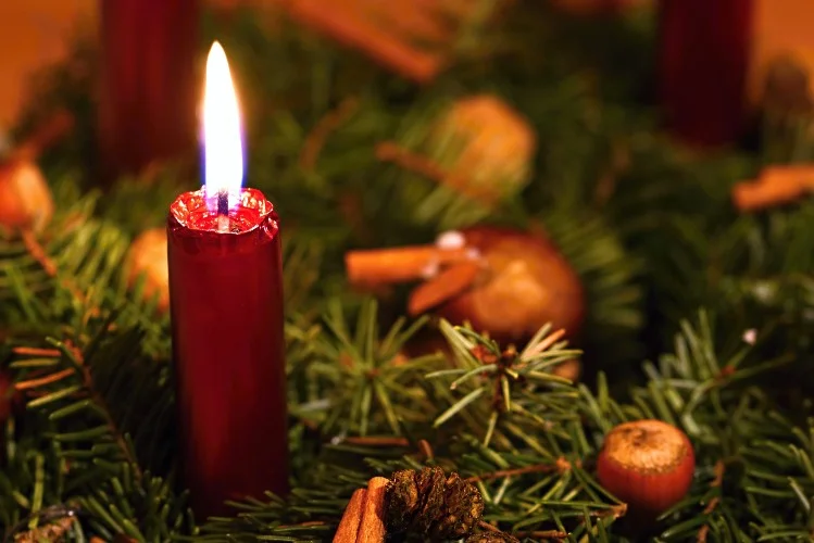 Burning red Christmas candle